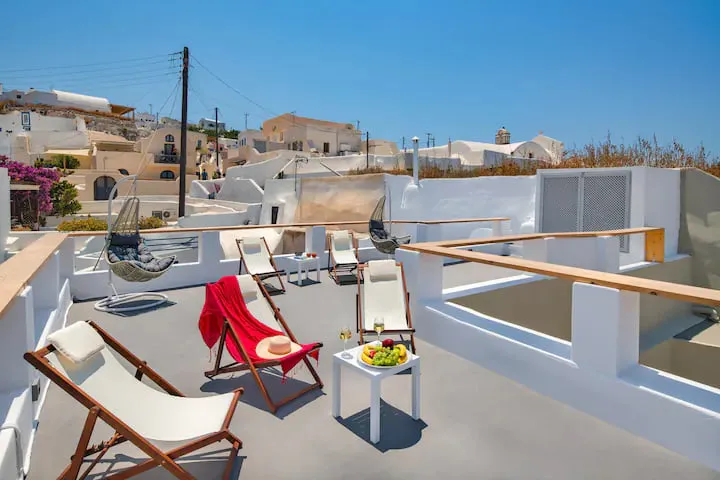 Aetheria Villas — terrace with Santorini village view